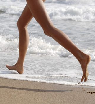 Barefoot Running On Beach
