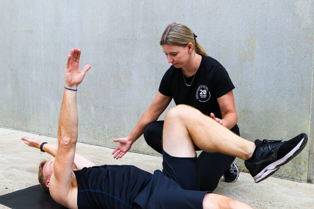 Osteo instructing an exercise